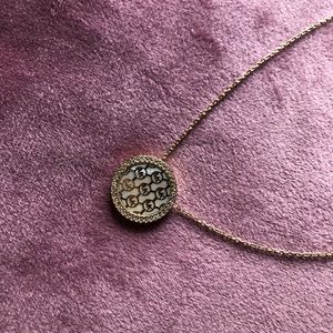 MICHAEL KORS GOLD TONE MOTHER OF PEARL PENDANT